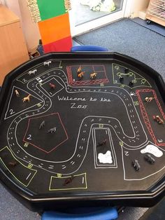 a play table with toy cars on it