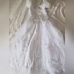 Beautiful Dress From "The Rain Kids Corp", Could Be Used As A 1st Communion Or Baptismal Dress. Has Never Been Worn, Only Tried On Once And Was Grown Out Of By The Time The Ceremony Came Around. This Dress Really Is So Much Prettier In Person And I Hope Someone Will Love It As Much As I Did. Originally Bought For $100, Asking $80. Still Have The Tags, And Original Bag It Came In. Comes With The Dress, Cape And Headband As Pictured. Size: Small/6 Color: White Fitted First Communion Dress, White Fitted First Communion Dress, Fitted Princess Dress For First Communion, Princess Style Fitted Baptism Dress For First Communion, White Fitted Baptism Dress For Confirmation, White Fitted Baptism Dress For Pageant, Fitted White Baptism Dress For Pageant, White Fitted Baptism Dress, Princess Style Baptism Dress For First Communion