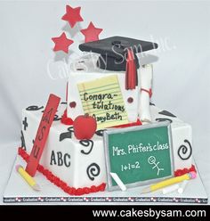 a graduation cake with writing and decorations on it