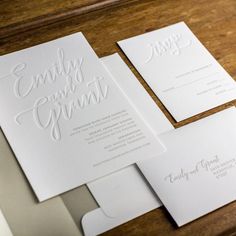 the wedding stationery is laid out and ready to be put into their guests'names