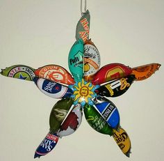 an ornament made out of beer bottle caps