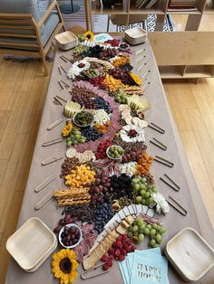 a long table covered with lots of different types of food