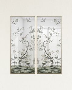 two framed pictures with flowers and birds on them