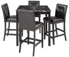 a marble top table and four chairs with black leather upholstered backrests