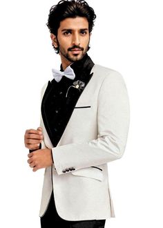 Mens peak collar slim fitted western tuxedo suit 2 pc (Jacket, Pant) made from off-white color polyester blend fabric. It has black trousers. Perfect for weddings, graduation ceremony, dating, meeting, yacht party, banquet, host's wearing, etc Dry clean only; Made in India Party Wear Blazers, Banded Collar Shirts, Yacht Party, Tuxedo Suit, Western Theme, Black Trousers, Linen Blazer, Off White Color, Collar Shirts