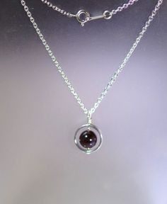 "This simple yet lovely necklace features a lovely 8mm Gemstone (pick your stone) on a beautiful 16, 17\" or 18\" sterling silver chain with a sterling silver clasp. Comes boxed and ready for gift giving. Available in Garnet (January), Bloodstone (March), Amethyst (February), Aquamarine (March), Green Aventurine, Black Onyx, Faceted Black Tourmaline, and Pyrite. Other stones are available - contact me for availability and pricing" Lovely Necklace, Black Tourmaline, Necklace Sterling Silver, Birthstone Necklace, Green Aventurine, Sterling Silver Chain, Sterling Silver Necklace, Glass Jewelry, Black Onyx