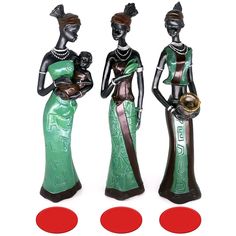 three figurines are standing next to each other with red circles in front of them