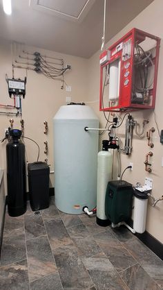 a room filled with different types of water heaters