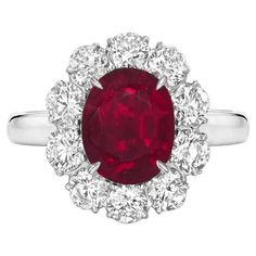 An exquisite 8 carat pinkish red purple oval no-heat ruby commands attention in this extraordinary platinum classic ring. A halo of approximately 1.50 carats of bright white (E/F) and (VS) diamonds encircle the stunning ruby, giving it a base of fire and sparkle from which to dominate the room. Unheated rubies of this color, clarity, and size are incredibly rare. Is not only a real gem quality ruby with a proper certificate (GRS Switzerland is one of the best colored gemstones laboratory) but is also eye clean! please take a look at the closeup pictures of the stone they were taken with a high resolution lense. Is an Extraordinary ruby that glows with an intensity that burns into your heart. Cushion Cut Diamond Ring, Ruby Diamond Ring, Ruby Diamond Rings, White Diamond Ring, Gold Cocktail Ring, Ruby Engagement Ring, Diamond Cocktail Rings, Vs Diamond, Modern Ring