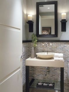 a bathroom with a sink, mirror and shower stall in it's own photo