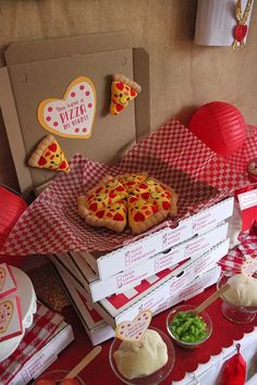 a table topped with pizza and other food items