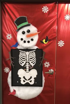 a door decorated with a snowman and skeleton