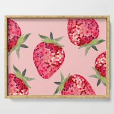 a pink tray with some strawberries on it and green leaves around the edges, in front of a light pink background