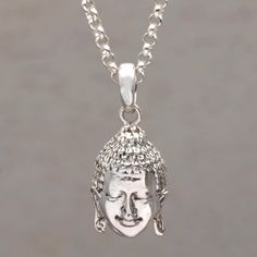 The serene face of Buddha shines from this pendant necklace centering a length of rolo chain. Balinese artisans handcraft the pendant of sterling silver adding a combination of finishes to give it a striking design. Nyoman Ariawan designs this necklace. Spiritual Jewelry With Round Pendant Box Chain, Spiritual Box Chain Jewelry With Round Pendant, Spiritual Jewelry With Box Chain And Round Pendant, Symbolic Sterling Silver Necklace For Meditation, Symbolic Sterling Silver Jewelry For Meditation, Spiritual Sterling Silver Jewelry With Large Pendant, Sterling Silver Symbolic Necklace For Meditation, Silver Engraved Necklace For Meditation, Spiritual Sterling Silver Necklaces With Oxidized Finish