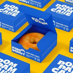 six boxes with donuts in them on a yellow and blue background