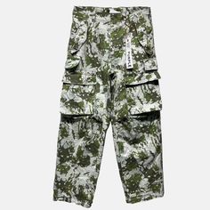 Style No. P527-DPMG124 Color: Green/Multicolor Cut from sturdy camo-print fabric, this cargo pant is a utilitarian classic. It has multiple pockets, including four at the sides and two at the legs, finished with an inner lining, and signature hang tag branding. Baggy. Mid Rise. Brushed Twill. Allover Digit Print. Double Cargo Pockets. Drawcords at Waistbands and Hem. Purple Brand P527 Double Pocket Cargo. Military Style Cargo Jeans With Multiple Pockets For Streetwear, Combat Parachute Pants With Multiple Pockets, Cotton Combat Cargo Pants With Functional Pockets, Military Style Cargo Jeans With Patch Pockets For Streetwear, Military Style Streetwear Pants With Functional Pockets, Military Style Cargo Pants With Multiple Pockets For Streetwear, Camouflage Techwear Cargo Pants With Side Pockets, Camouflage Cargo Jeans With Patch Pockets For Streetwear, Urban Camouflage Parachute Pants With Pockets