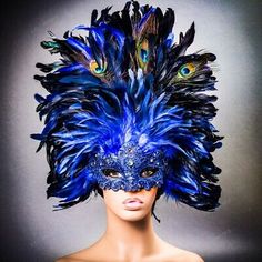 Color: Blue Mask with Blue Feather. Made from lace, paper mache, resin, and feather. Elegant Blue Masquerade Mask For Parties, Mardi Gras Feathered Masquerade Mask For Party, Blue Masquerade Mask For Mardi Gras Carnival, Mardi Gras Masquerade Mask With Feathers For Party, Mardi Gras Party Masquerade Mask With Feathers, Feathered Masquerade Mask For Carnival Party, Fitted Masquerade Mask For Carnival Party, Black Masquerade Mask For Party Festivals, Black Masquerade Mask For Party And Festivals