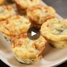 a white plate topped with mini muffins on top of a table