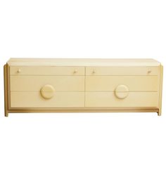 a white dresser with three drawers and two knobs