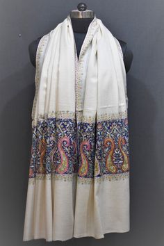 A product by HOUSE OF MIRS C.1885 (Kashmir, India) Around 600 years old culture of Kashmir, Hand embroidery is part of the Kashmir's culture for centuries. We have been associated with this industry C.1885 This Shawl is hand embroidered here in the beautiful Kashmir Valley. We use a tiny needle for embroidery to make sure we have fine stitches. Hand embroidery is both men's and women's job and we are proud to have some very talented craftswomen associated with us. A shawl takes months to years t White Pashmina Shawl With Resham Embroidery, Pashmina Scarves With Traditional Patterns For Festivals, Festival Pashmina Shawl With Embroidered Border, Traditional Pashmina Shawl With Traditional Patterns, Traditional Pashmina Scarf With Traditional Drape, White Pashmina Shawl With Traditional Drape, White Pashmina Shawl In Traditional Drape, White Pashmina Shawl With Motifs, Embroidered Pashmina Scarves For Festivals