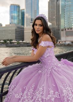 Look like a fairy-tale Princess in this 3D floral applique long off shoulder dress with A-line skirt by Rachel Allan RQ1134. Look no further than the glitter tulle Quinceanera gown, perfect for your big day! This dress is designed with intricate details that show off your unique personality and style. From the delicate 3D flowers that capture the sparkle in the day, to the exquisite applique and beading that adorns the top of the dress, this gown is sure to make a statement. Let's not forget the Off-shoulder Tulle Quinceanera Dress For Prom Season, Off-shoulder Tulle Quinceanera Dress, Off-shoulder Tulle Dress For Quinceanera, Long Off Shoulder Dress, Mary's Bridal, Purple Wedding Dress, Pretty Quinceanera Dresses, Cinderella Divine, Dresses Quinceanera