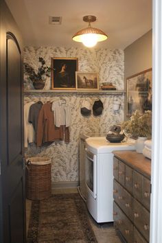 a laundry room with an old fashioned washer and dryer