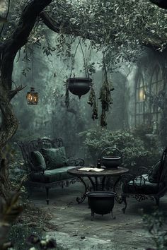 an outdoor seating area in the middle of a forest with lots of trees and hanging lanterns