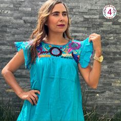 This feminine vintage style shirt is beautifully made. Colorful flowers, it is a unique one of a kind. Since it is hand embroidered, each flower is slightly different. It is made of cotton and it extremely comfortable. Beautiful Blouse, made with 100% cotton blanket, dyed in bright colors. The ruffles that distinguish this blouse are made by hand, by artisans from Chiapas. Beautiful blouse, you can use it with jeans, leggings, skirts, it is a very elegant blouse and has a beautiful and fine embroidery About Our Items: Each one of our items are handmade/hand woven by Indigenous communities of Chiapas and Oaxaca in Mexico. Great care has been taken to ensure the quality of uniqueness of each item we sell.  Our items are made of cotton. Each flower on each item will be a bit different as they Casual Turquoise Cotton Blouse, Traditional Blue Summer Shirt, Summer Festival Embroidered Shirt, Bohemian Shirt With Multicolor Embroidery, Traditional Blue Shirt For Summer, Summer Folk Style Embroidered Shirt, Embroidered Folk Shirt For Summer, Blue Folk Style Summer Blouse, Casual Floral Embroidered Blouse For Festivals