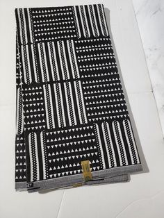 DESCRIPTION Black and White African Ankara Fabric. This is high quality African print is 100% cotton and it's 45 inches wide. It is used for making African Clothing, African quilts, & For Home decoration. FYI: Print is Double sided. The listing is for Per yard, 6yards and Headwrap For Each piece of fabric measures: 70-72in by 45in for 2yards 105-108in by 45in for 3yards 210-216in by 45in for 6yards 70in by 22in for Headwrap If you purchase more than one yard, you will receive one continuous piec African Quilts, Clean And Press, Head Wrap Headband, African Ankara, Ankara Fabric, Mixing Fabrics, African Clothing, African Print, Head Wraps