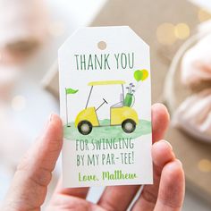 a person holding up a card that says thank you for swinging by my par - tee