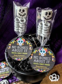 two skeleton candy boxes with no bones allowed labels on them, sitting next to each other