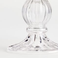 a clear glass candle holder on a white background