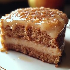 a piece of cake sitting on top of a white plate with caramel toppings