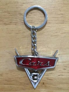 a car keychain with the word cars on it's front and side