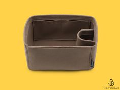 an image of a dog bed on a yellow background