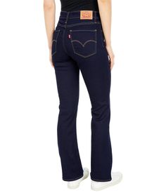 The Levi's® Womens 725 High Rise Bootcut boasts a classic silhouette with modern touches. The five-pocket jean features a modern high waist with a slim fit in the hip and thigh that flows to a generous knee break..Signature arcuate stitch accents the back pockets..Belt loop waistband with brand patch at the back waist, zipper fly, and button closure..78% cotton, 21% polyester, 1% elastane..Machine wash..Imported..Product measurements were taken using size 25, inseam 32. Please note that measurem High Rise Bootcut Jeans, Black Tears, Woman Wine, Levi Jeans Women, Pants Jeans, Pocket Jeans, High Rise Jeans, Soft Black, Product Reviews