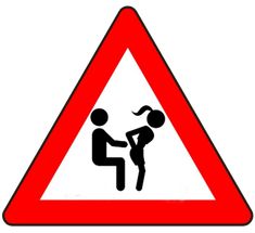 a red and white triangle sign with a woman holding a baby