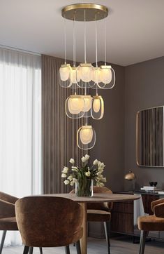 a dining room table with chairs and a chandelier hanging from it's ceiling