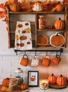 a shelf filled with pumpkins and other decorations