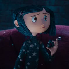 an animated doll holding a cell phone in her hand and looking up at the camera