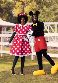 two people in mickey and minnie mouse costumes