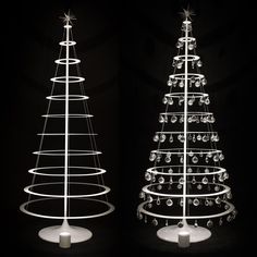 three different types of christmas trees on display in black and white photo with circular lights