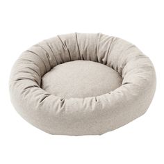 a round dog bed with a white background