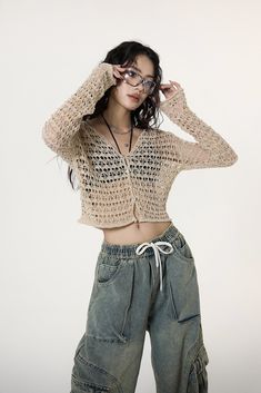 Experience the unique blend of comfort and style with our Crochet Crop Top, enriched with flare sleeves that exude a carefree spirit. Finely crafted with 100% polyester for durability, this cozy crop heading Top features a distinctive crochet pattern, adding a touch of texture and a flair to your wardrobe. Its loose knit design paired with flare sleeves offers both breathability and an edgy fashion statement, perfect for trendsetters. Pair it with high-waisted jeans or relaxed cargo pants for a laid-back look, or dress it up with a chic maxi skirt for an evening out. Ideal for a range of occasions, it embodies a fusion of freedom, passion, and creativity, making it more than just a piece of clothing - it's an attitude towards life. Product specifications: Material: 100 % PolyesterFit: Conv Chic Open Knit Cropped Sweater For Summer, Trendy Long Sleeve Cropped Sweater For Summer, Trendy Cropped Summer Cardigan, Cropped Sweater For Summer, Casual Open Knit Cropped Sweater For Spring, Trendy Fitted Cropped Sweater For Summer, Casual Stretch Cropped Sweater For Summer, Trendy Open Knit Cropped Sweater For Summer, Trendy Long Sleeve Open Knit Crop Top