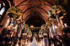 a bride and groom are walking down the aisle at their wedding ceremony in an old church