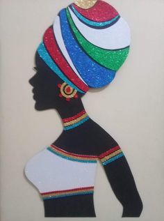 a paper cut out of a woman's head wearing a colorful hat and earrings