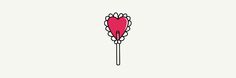 a heart shaped lollipop on a stick