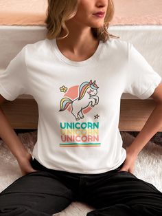 Unleash your magical side with our "Triple Unicorn Magic" t-shirt! This enchanting design features a beautifully illustrated unicorn above the word "unicorn" repeated three times for extra charm. Perfect for dreamers and fantasy lovers, this tee brings out the wonder and whimsy in anyone who wears it. Made from soft, premium fabric for ultimate comfort, it's a stylish and fun addition to your wardrobe. Whether you're a fan of unicorns or just love a touch of magic, this shirt is the perfect way to express your mythical style! Order and Shipping: * All our t-shirts are made to order, leveraging our order on demand printing partners * Please allow 1-3 days for production and 2-5 business days for standard shipping. Please reference expected shipping times for your location during checkout. P Fun Unicorn Print T-shirt For Summer, Cute Unicorn Print Summer T-shirt, Summer Unicorn Print Short Sleeve T-shirt, Summer Unicorn Print Crew Neck Top, Summer Short Sleeve Unicorn Print T-shirt, Summer Crew Neck Top With Unicorn Print, Fun Summer T-shirt With Unicorn Print, Cute Multicolor Unicorn Print T-shirt, White Unicorn Print T-shirt For Summer