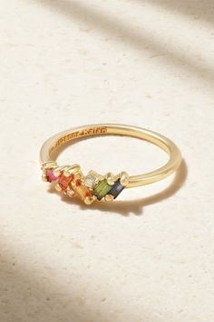 Suzanne Kalan's ring is encrusted with baguette-cut rainbow sapphires and tiny diamonds in the designer's signature 'Fireworks' setting - the result really is as spectacular as those you see in the sky. It's crafted from 18-karat yellow gold and perfect for stacking. Rwinbow Ring, Baguette Mothers Ring, Senior Rings, Ethereal Jewelry, Sister Rings, Ring Inspo, Mom Ring, Rainbow Sapphires, Suzanne Kalan