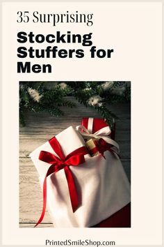 a white bag with red ribbon tied around it and the words 35 surprising stocking stuff for men